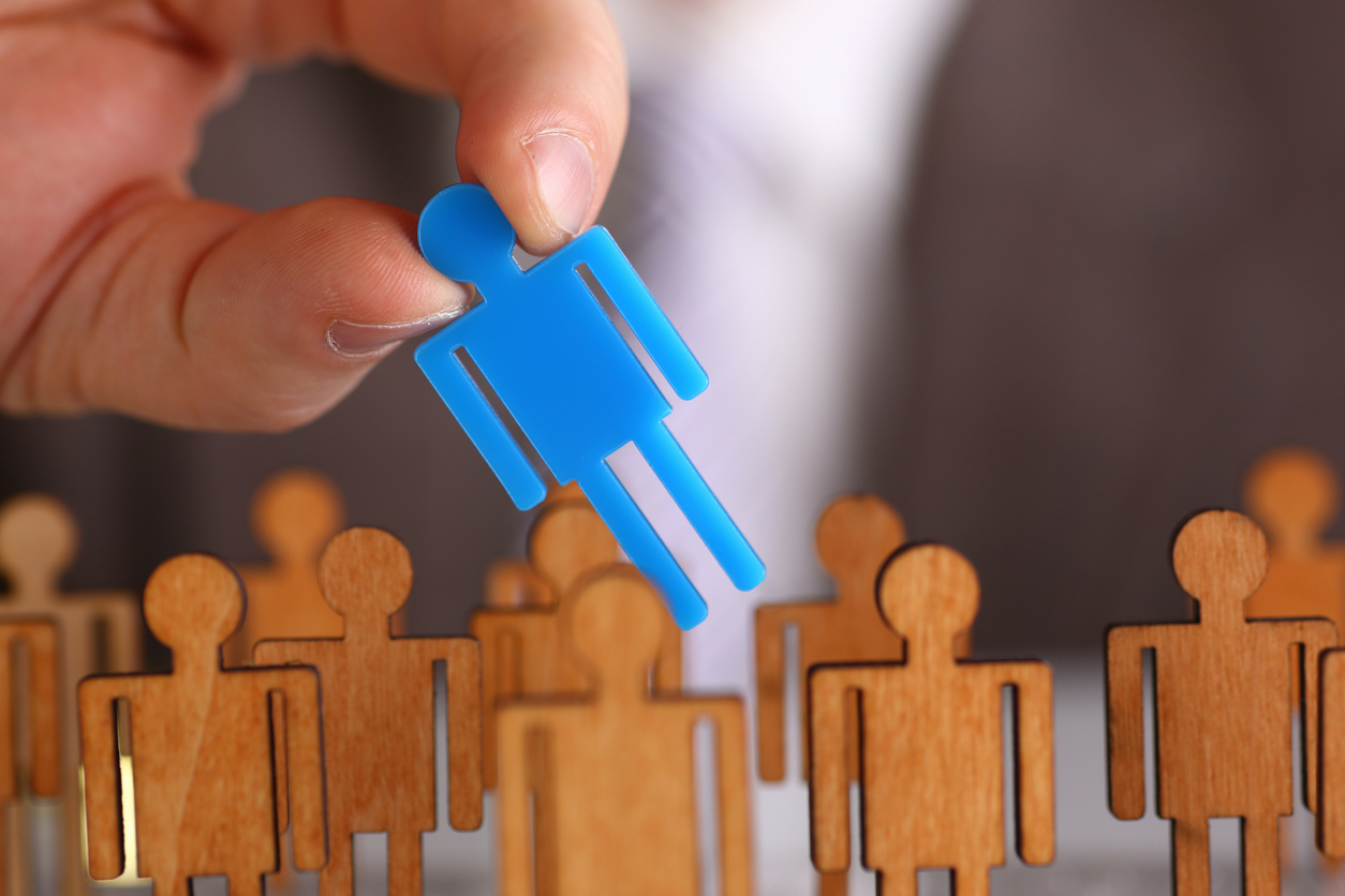 Man arm in suit take little plastic toy figure out of crowd closeup. Fire one worker hr job shift head hunter inspector rare disease unit dismissal retire lgbt media virus epidemic success concept